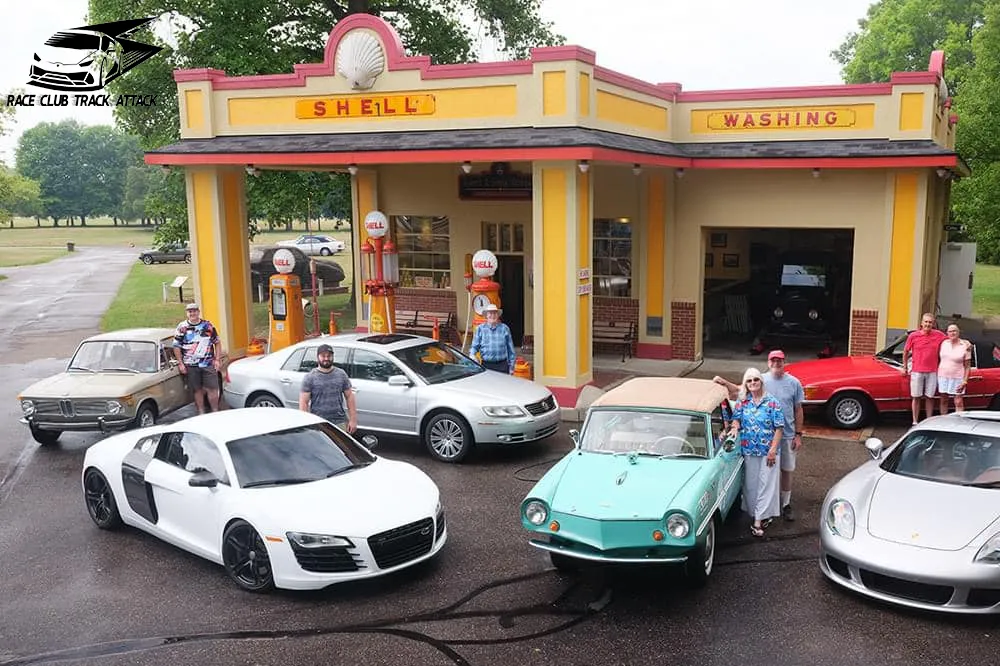 A group of cars parked in front of a gas station