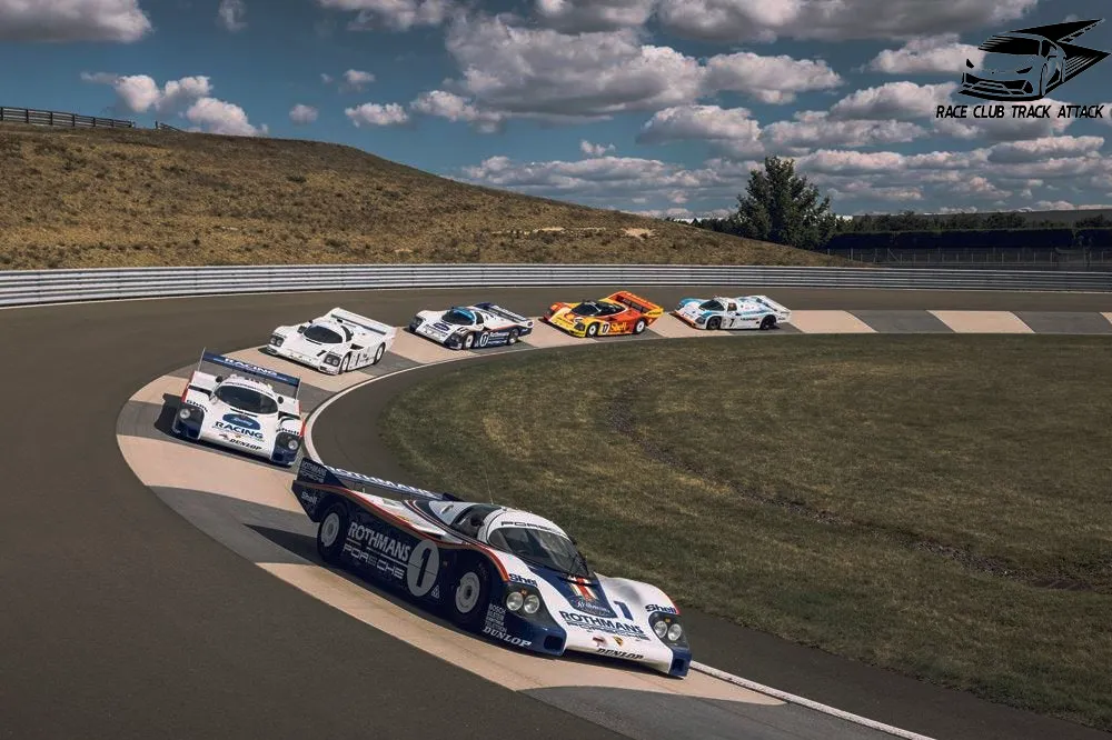A group of cars driving down a race track